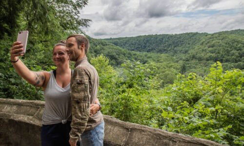 Couple taking a photo together overlooking Clear Fork Gorge
