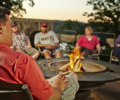 People sitting at a firepit