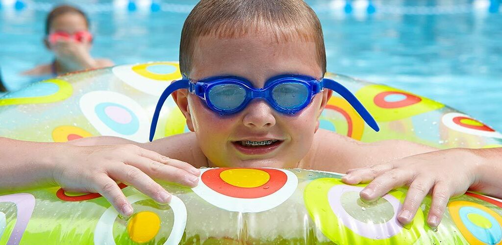Kid in a floaty in the pool