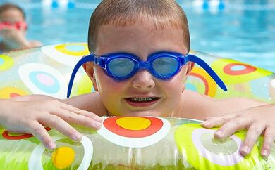 Kid in a floaty in the pool