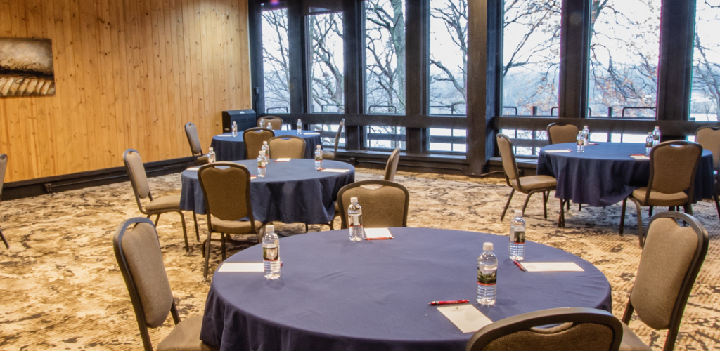 Conference room setup with round tables