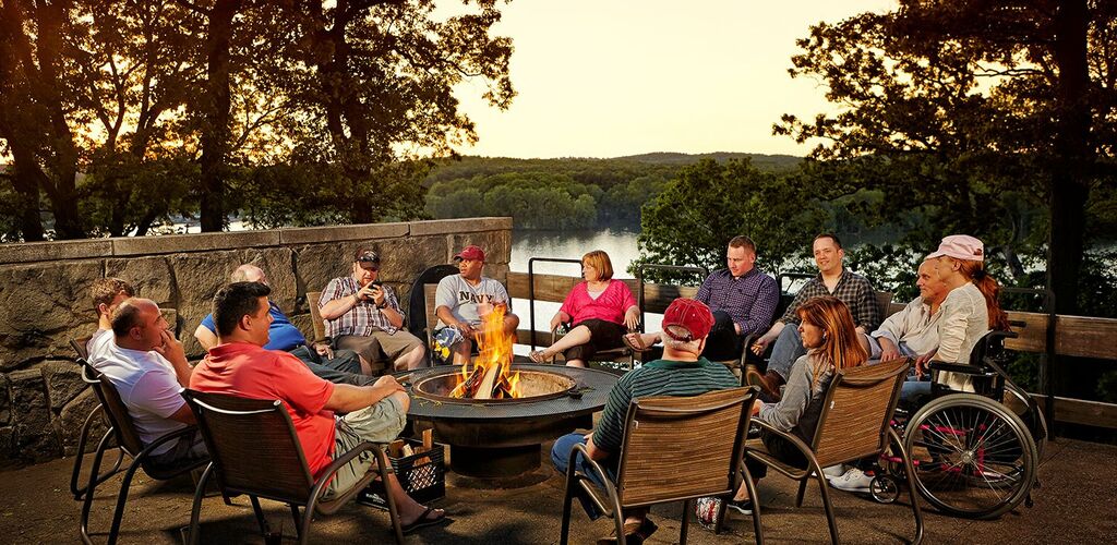 Family sitting around a campfire